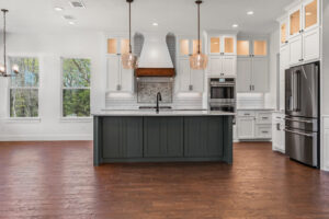 Kitchen island with sink - FM 275 new house built by LaRue Custom Homes