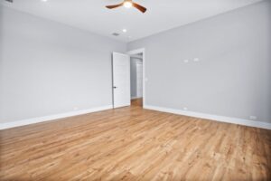 bedroom with wood flooring