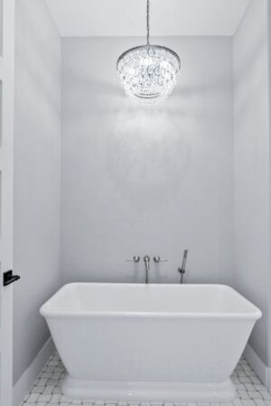 custom bathtub with chandelier