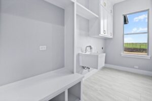 custom laundry room with storage