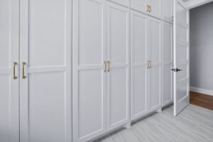 storage closet with gold handles